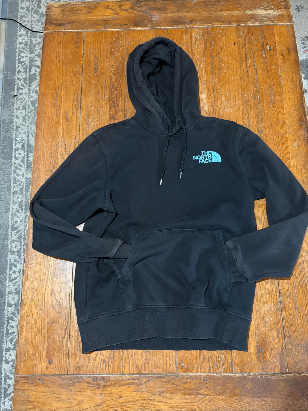 The North Face Black Pullover Hoodie with Teal Logo